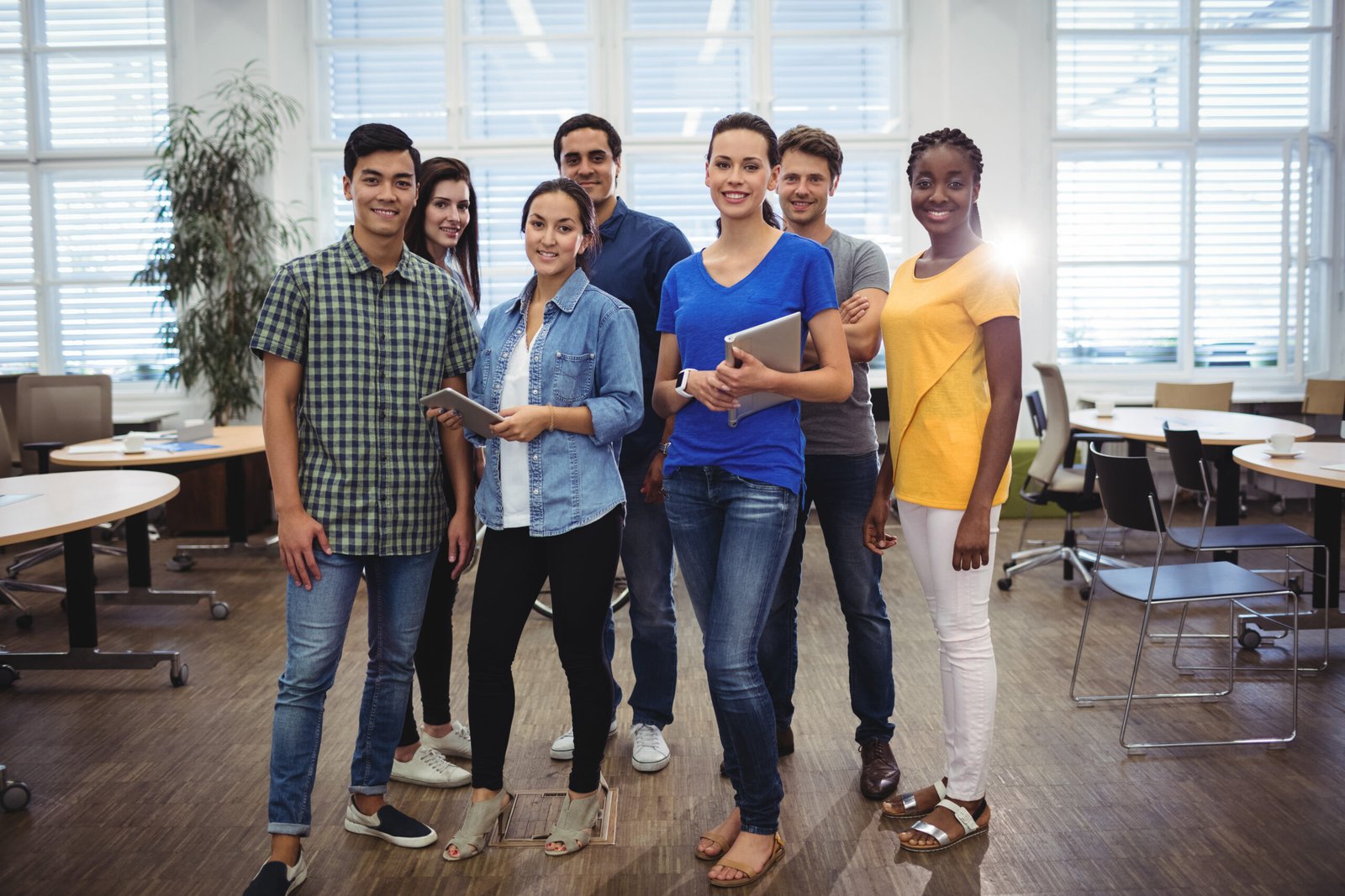 Group of business executives smiling at camera in the office